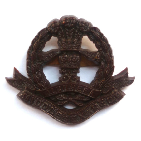 Middlesex Regiment Economy Plastic Cap Badge - British Military Insignia